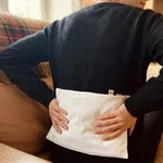 Bouillotte blé XL placée dans le dos